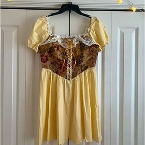 Vintage floral dress with cream yellow skirt and sleeves, lined with lace.